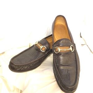 Men’s Gucci snake skin loafers.